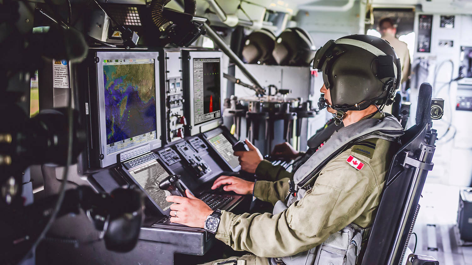 Member of the Canadian Armed Forces at console.