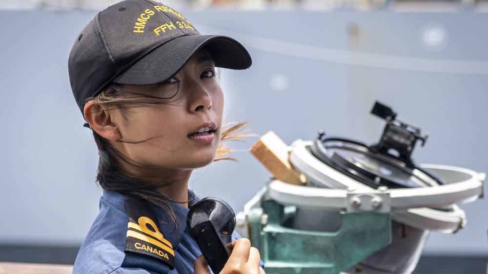 Woman in navy uniform on ship