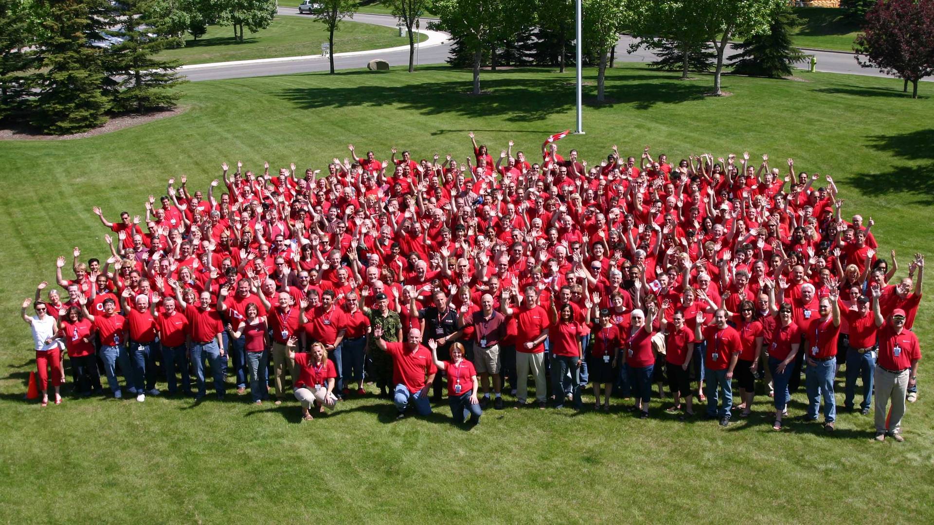 Crowd of General Dynamics Employees Wearing Red 