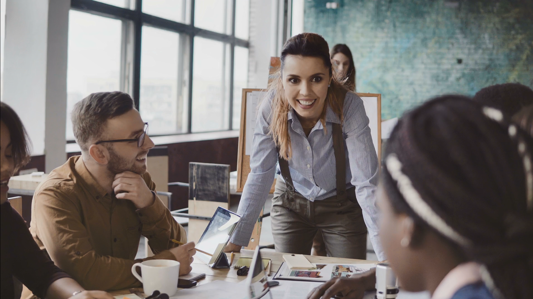 Female leader at a boardroom meeting with colleagues.