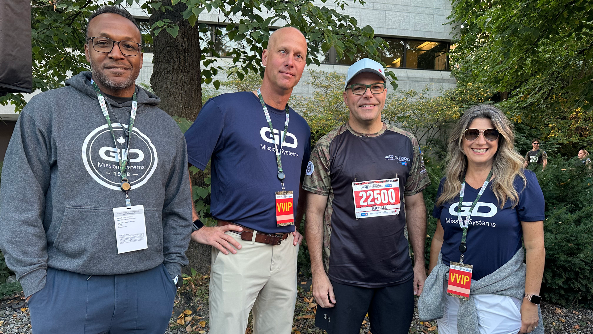Three GD colleagues standing with Commander of the Army