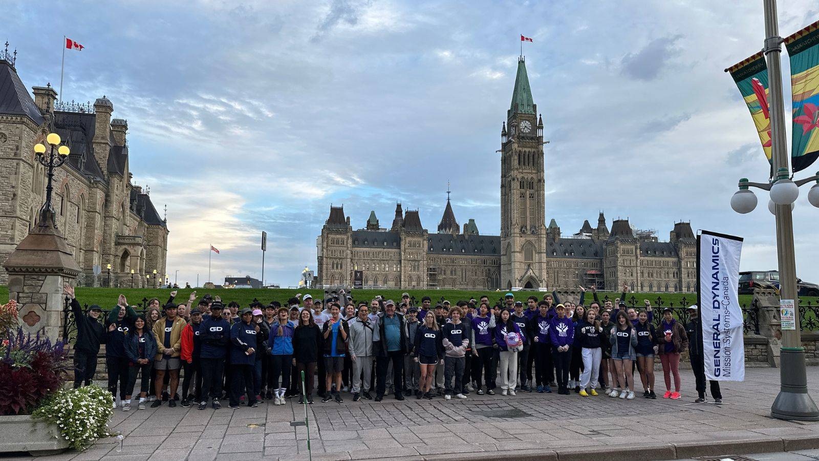 GD colleagues and volunteers in front of Parliament handing out water.