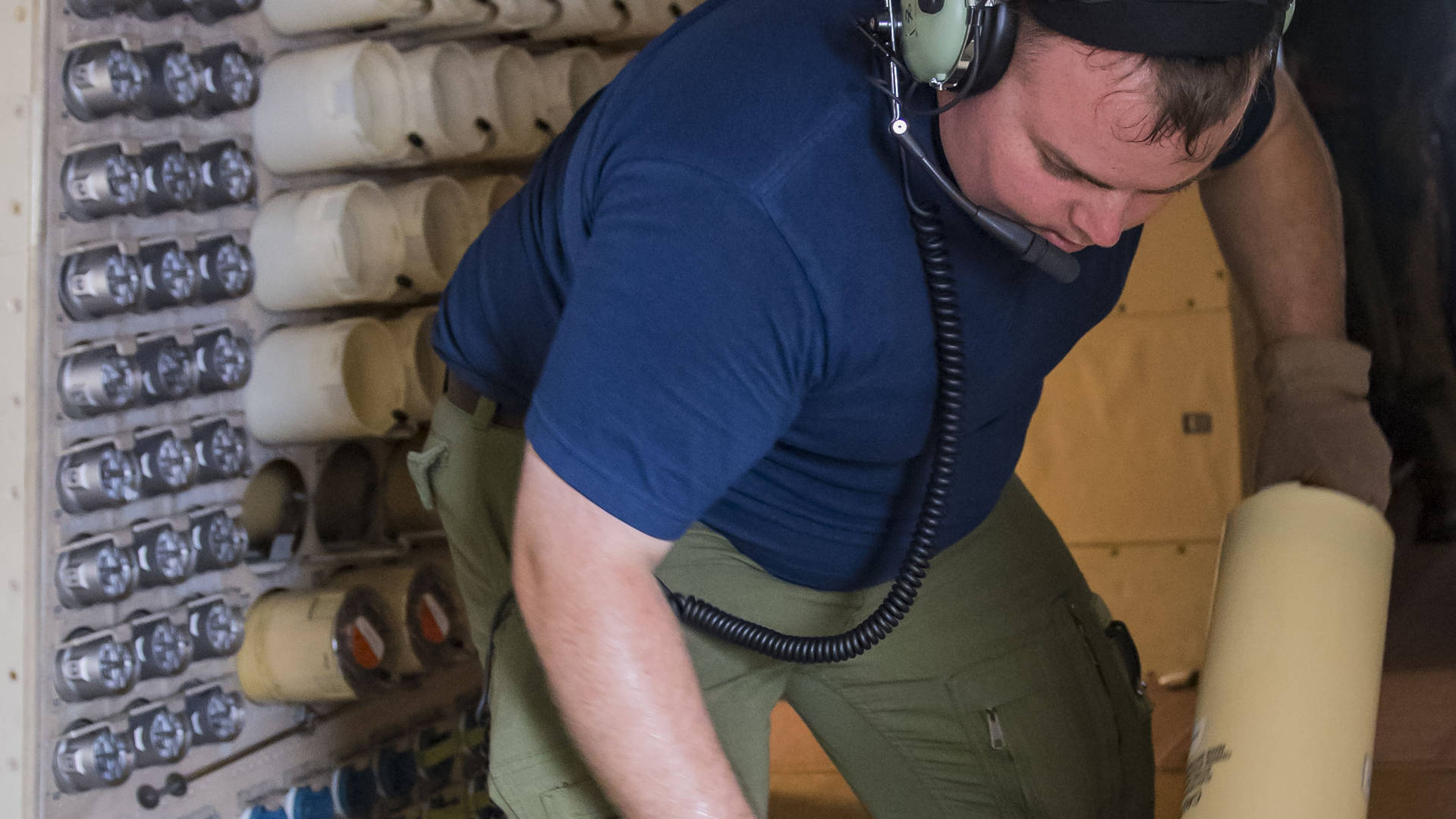 Man with headset fixing helicopter