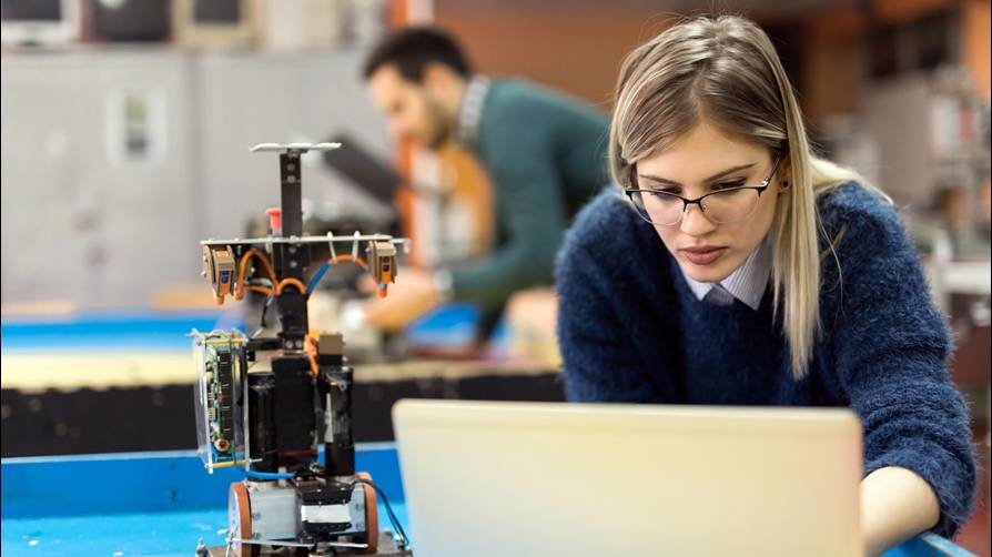 Woman on laptop in a lab