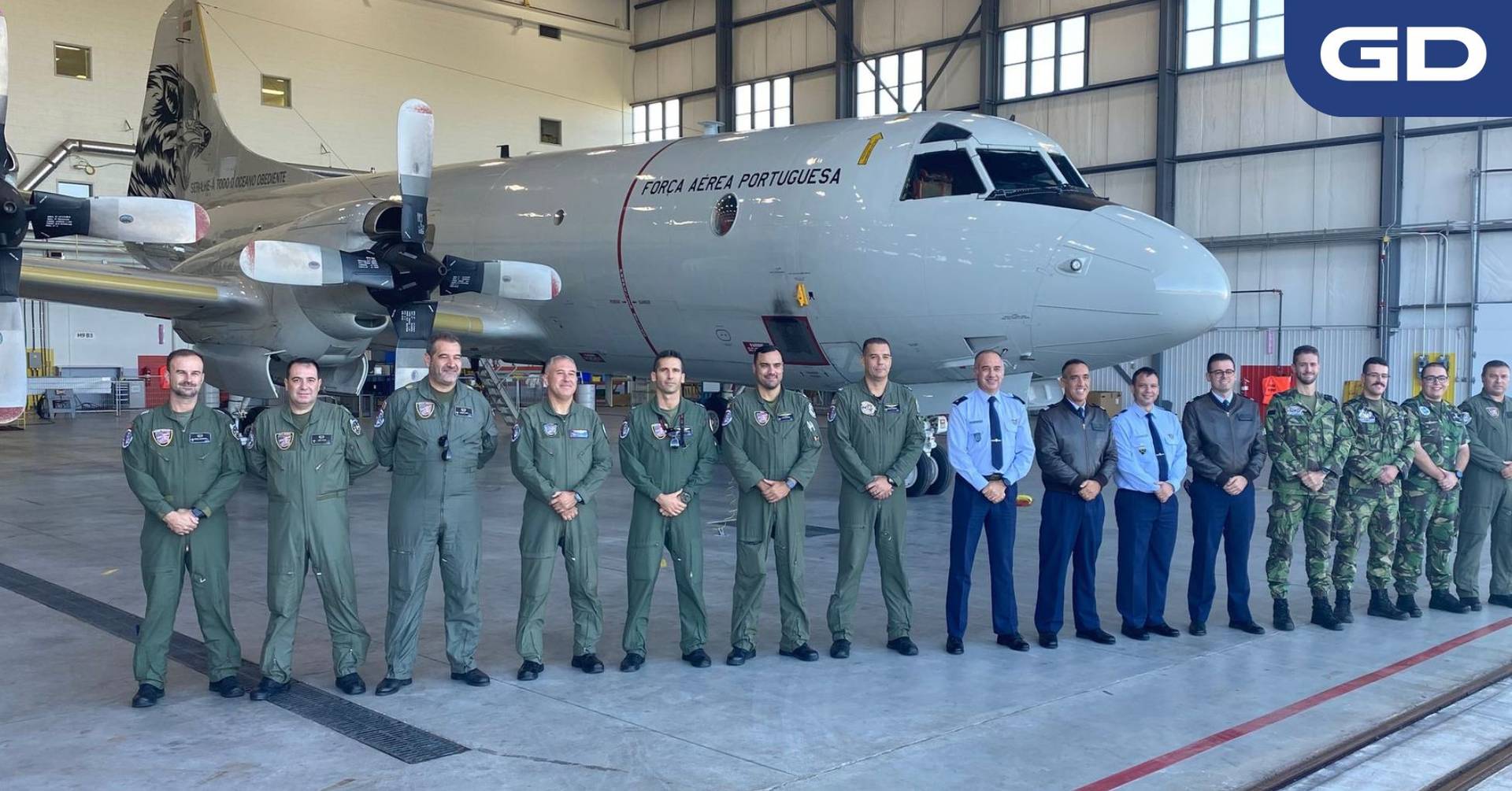 Air crew standing in front of a Portuguese P-3C aircraft.