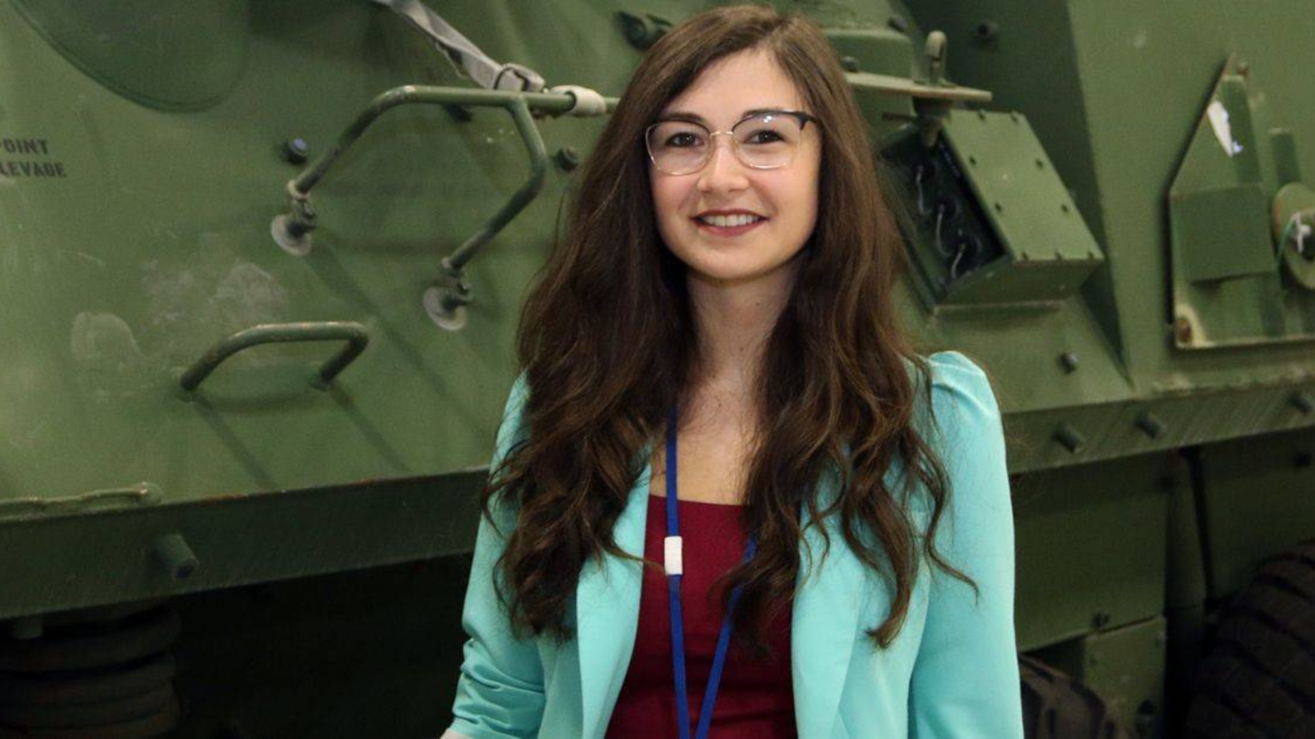 Employee smiling in front of LAV