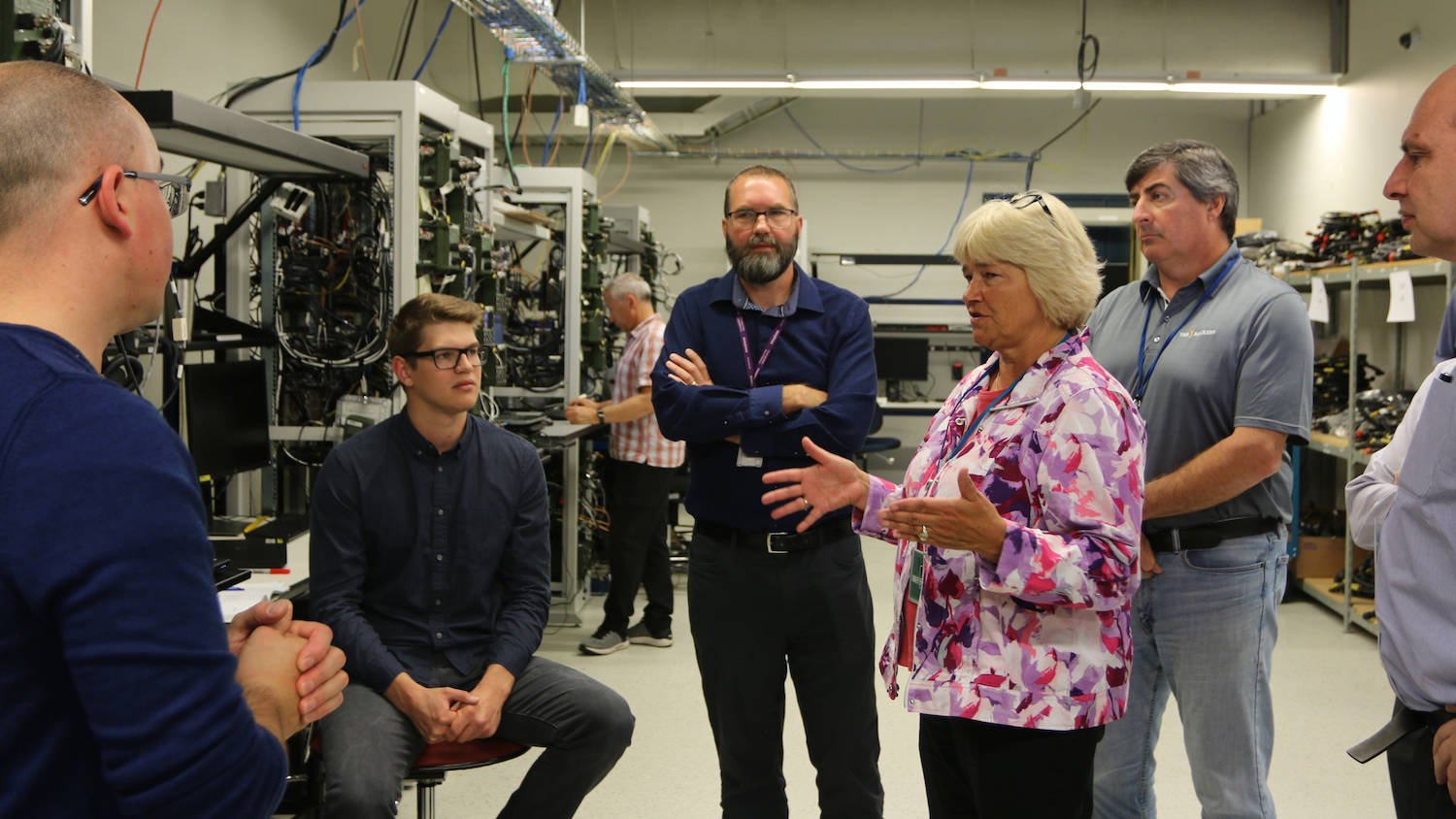 Woman Speaking to Group of Employees