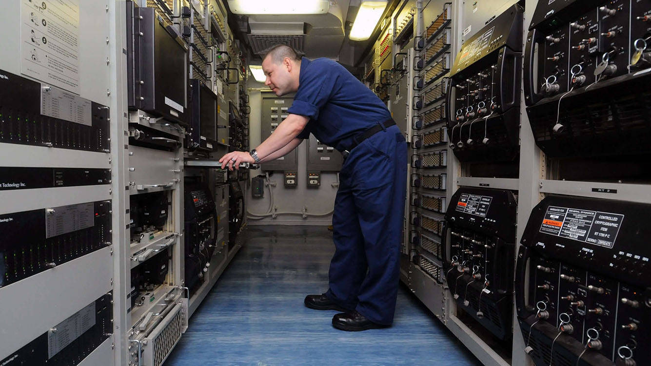 radios lining wall inside ship