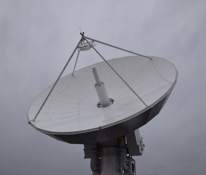 Ground satellite pointed to grey sky